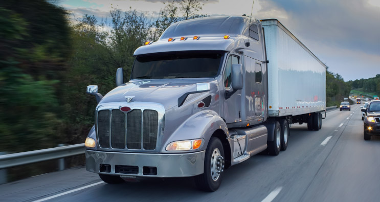 Truck driving in MO carrrying cargo that has a Inland Marine insurance policy from Midwest Preferred Mutual Insurance, the best Independent Insurance Agency in Tina & Maysville, MO.